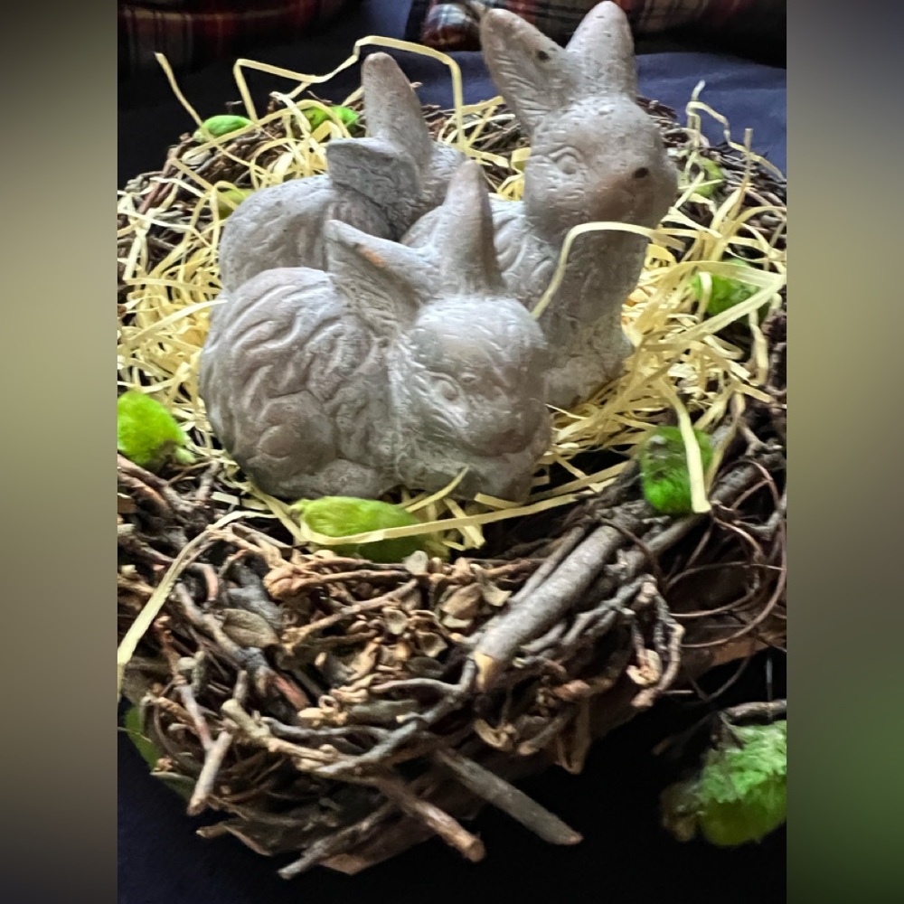 Three little bunnies nesting in a centerpiece